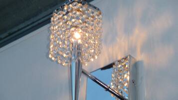 A modern light fixture with a spherical design and multiple bulbs.