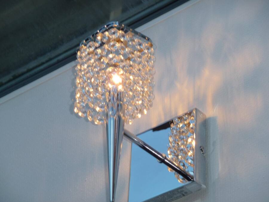 A modern light fixture with a spherical design and multiple bulbs.