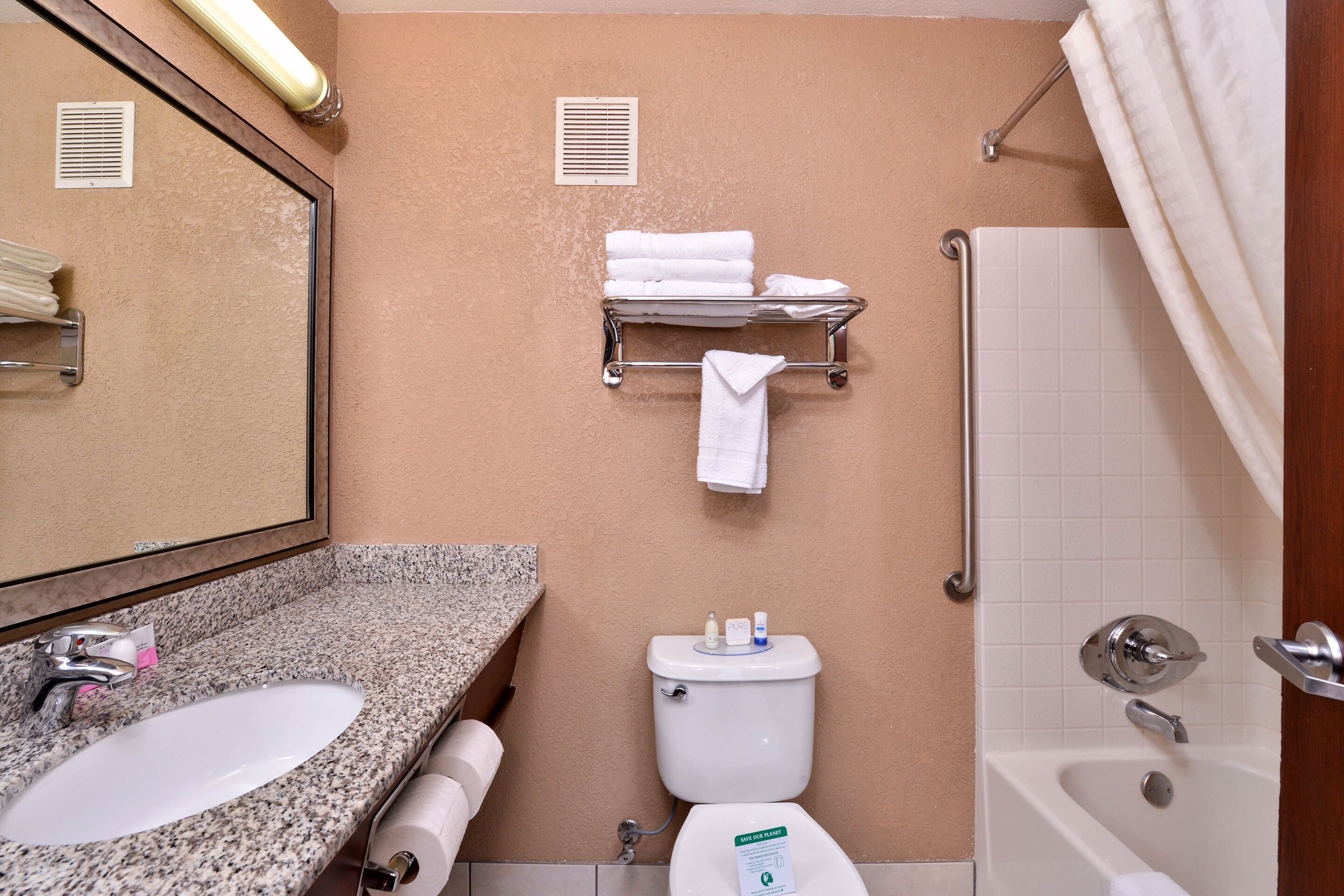 combined shower/bathtub, free toiletries, hair dryer, towels