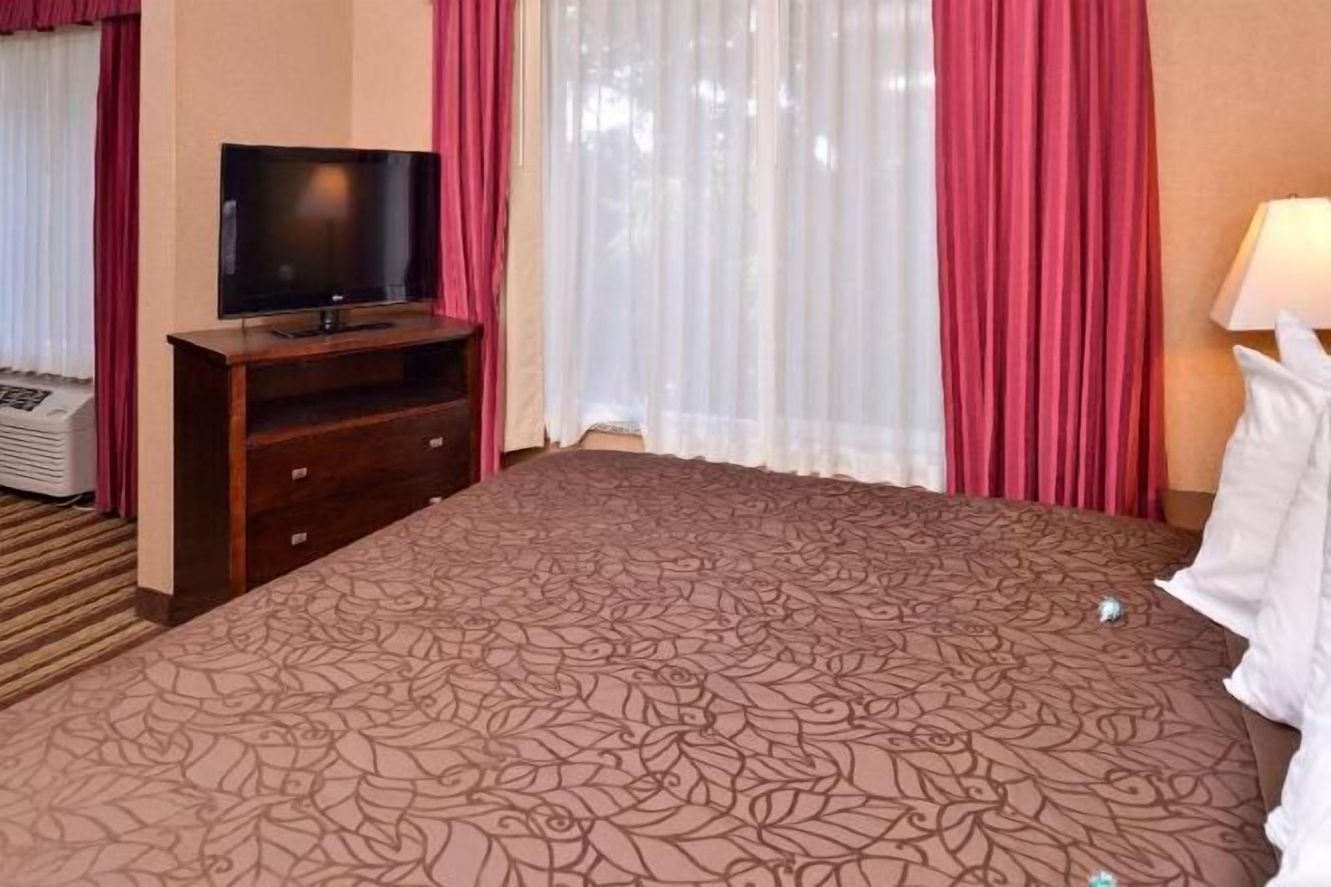 Pillowtop beds, blackout drapes, iron/ironing board, rollaway beds
