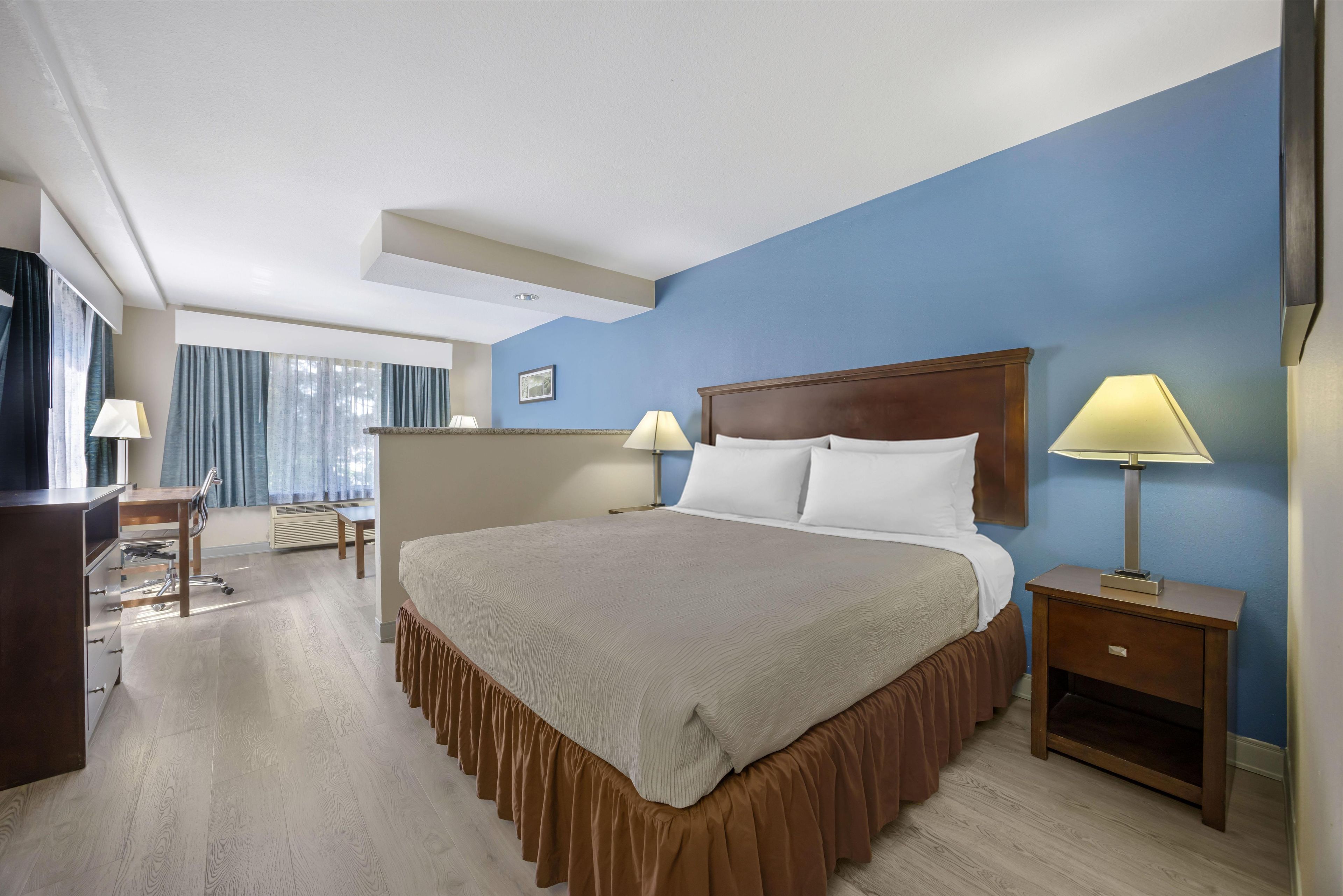 Suite, 1 King Bed, Non Smoking, Refrigerator & Microwave | Pillow-top beds, blackout curtains, iron/ironing board, rollaway beds