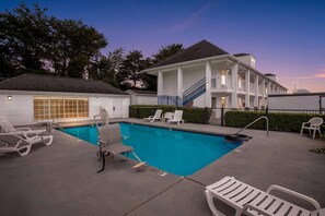 Seasonal outdoor pool, open 10:00 AM to 10:00 PM, pool loungers