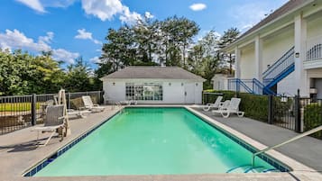 Seasonal outdoor pool, open 10:00 AM to 10:00 PM, pool loungers