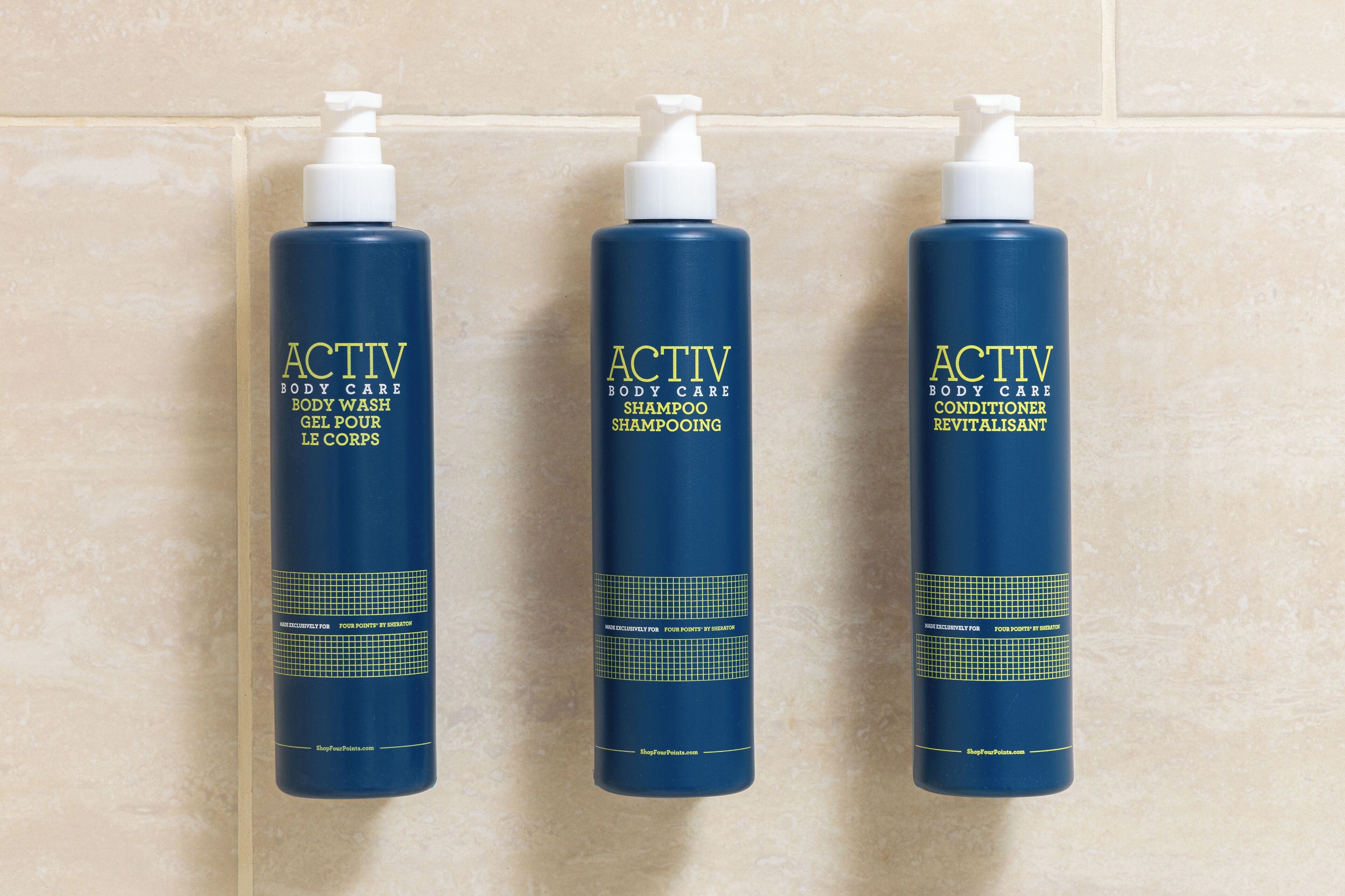 designer toiletries, hair dryer, towels