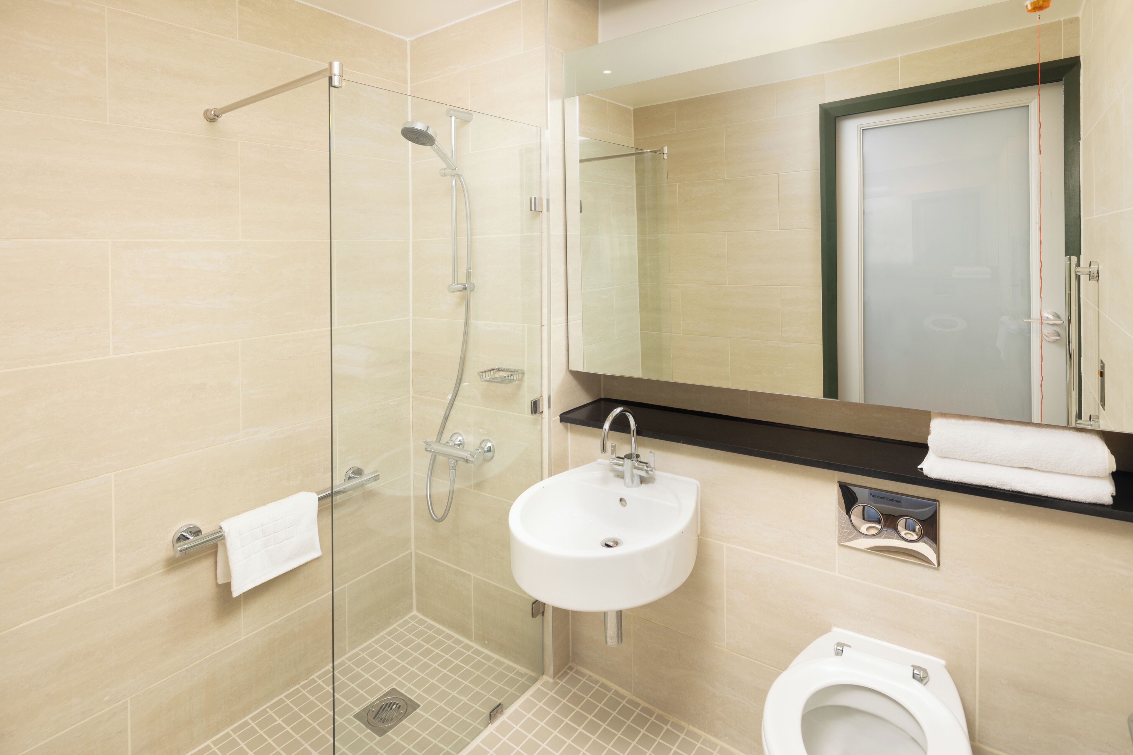 designer toiletries, hair dryer, towels