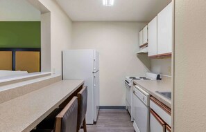 Full-sized fridge, microwave, stovetop, coffee/tea maker