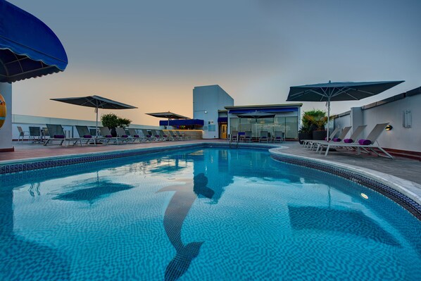 Outdoor pool, open 8:00 AM to 10:00 PM, pool umbrellas, sun loungers