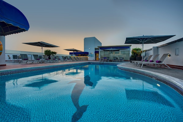 Outdoor pool, open 8:00 AM to 10:00 PM, pool umbrellas, pool loungers