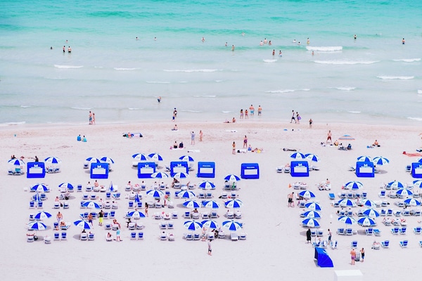 On the beach, white sand, beach towels
