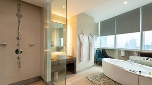 A modern bathroom with a glass-enclosed shower, a large bathtub, and a vanity with a mirror. - Holiday Inn Shanghai Pudong by IHG (Shanghai)