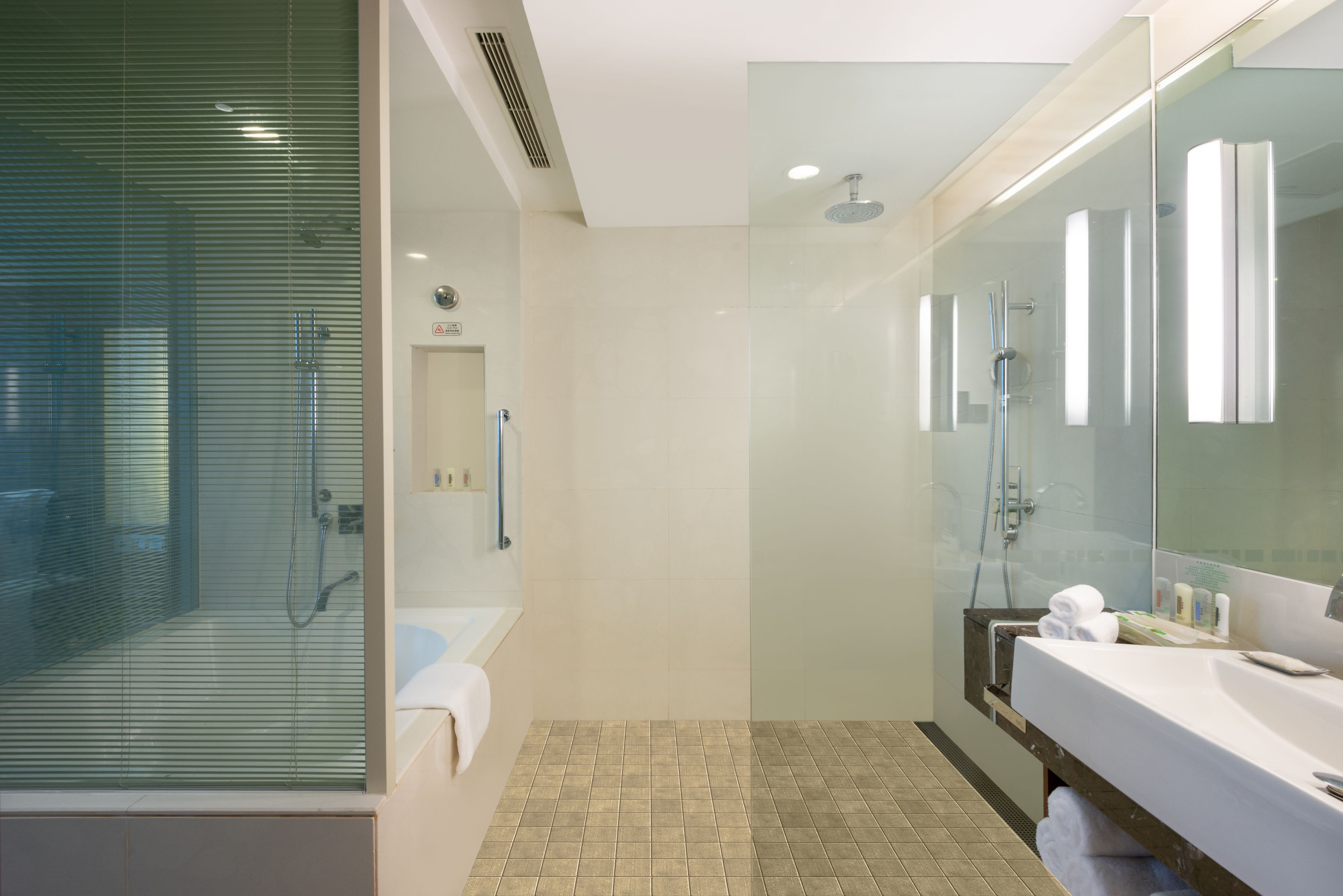 combined shower/bathtub, hair dryer, bathrobes, slippers