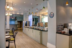 A modern hotel lobby with a central counter, seating area, and a non-smoking sign. - Best Western London Queens Crystal Palace Hotel (London)