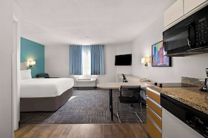 Premium bedding, desk, laptop workspace, blackout drapes