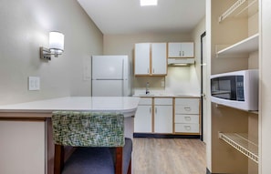 Full-sized fridge, microwave, stovetop, coffee/tea maker