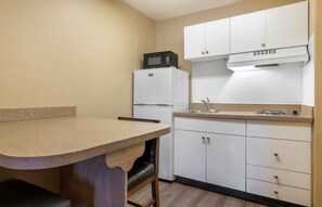 Full-sized fridge, microwave, stovetop, coffee/tea maker