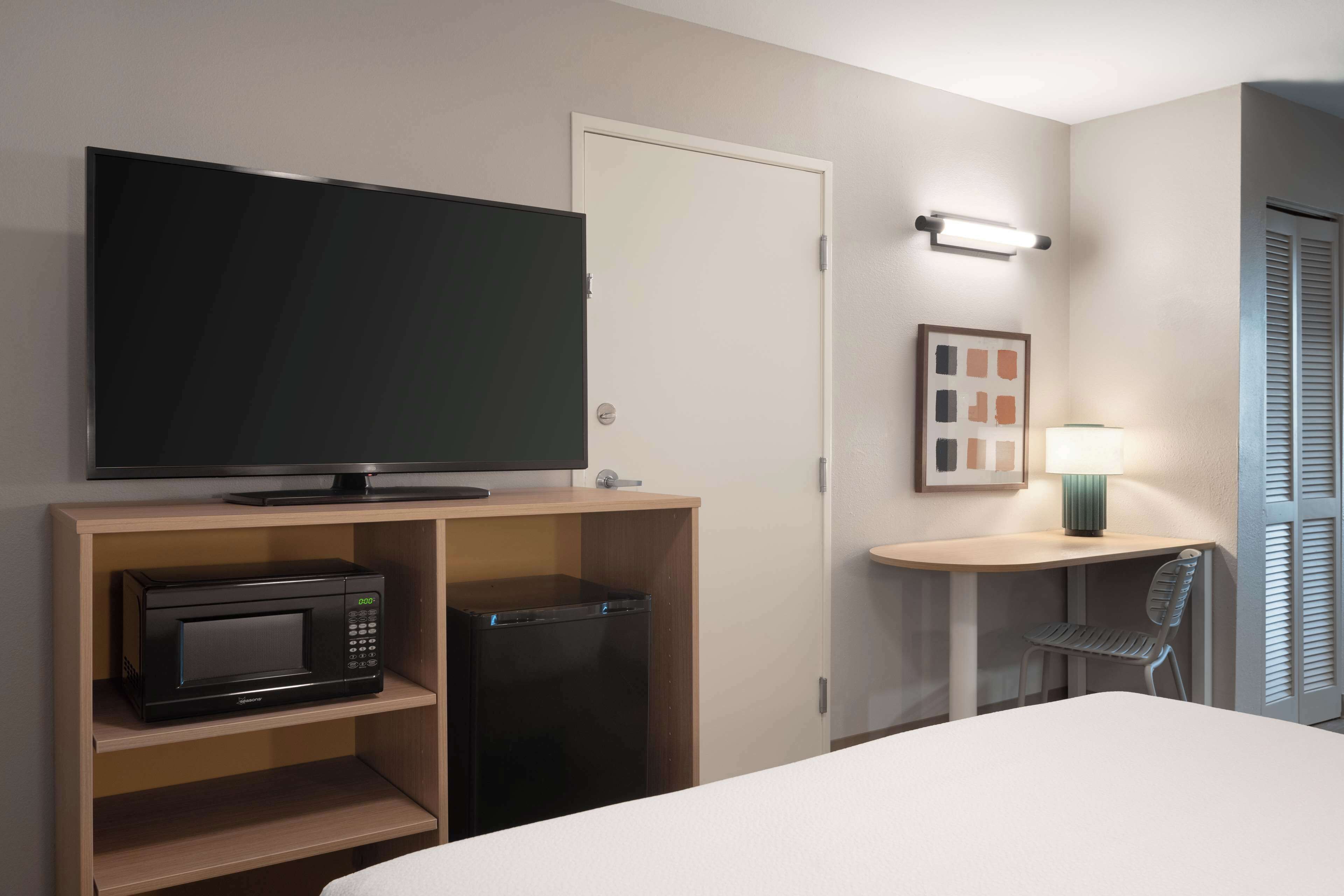 Suite, 2 Queen Beds | Desk, laptop workspace, iron/ironing board, free WiFi
