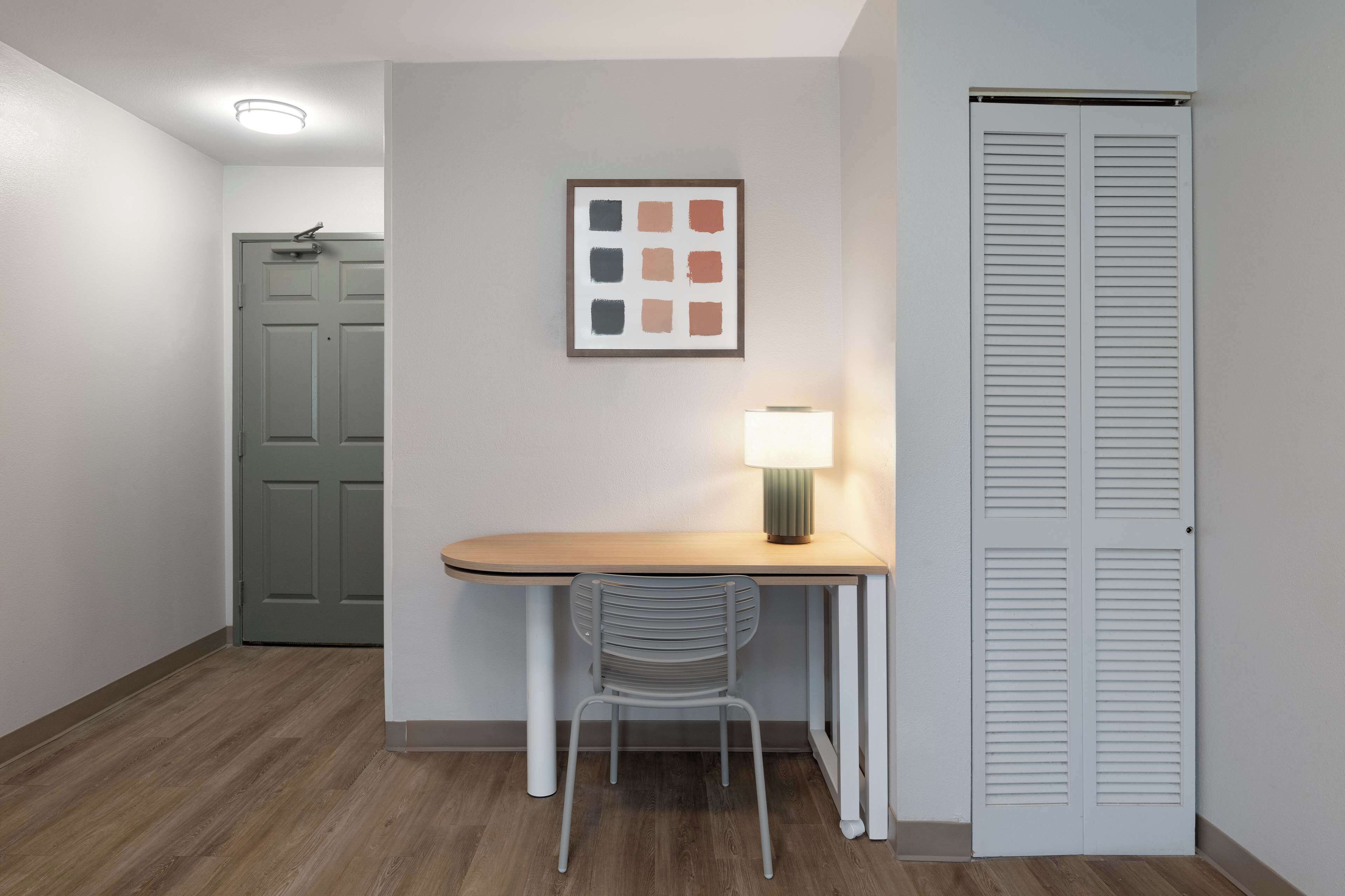 suite, multiple beds | in-room safe, desk, laptop workspace, iron/ironing board