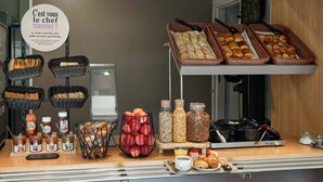 A breakfast buffet with various pastries, bread, and condiments. - B&B HOTEL Orly Rungis Aéroport (Rungis)