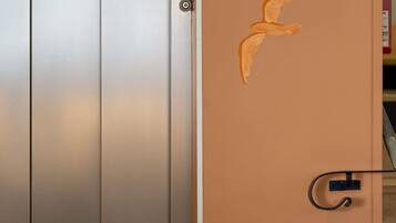 A door with a textured surface and a metal handle.
