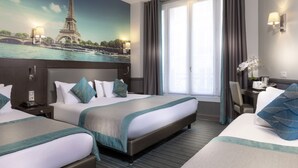 A hotel room with two beds, a mural of the Eiffel Tower, a window with curtains, and a nightstand with a lamp. - Hotel Elysées Céramic (Paris)