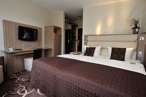 Luxe beddengoed, een minibar, een kluis op de kamer, een bureau
