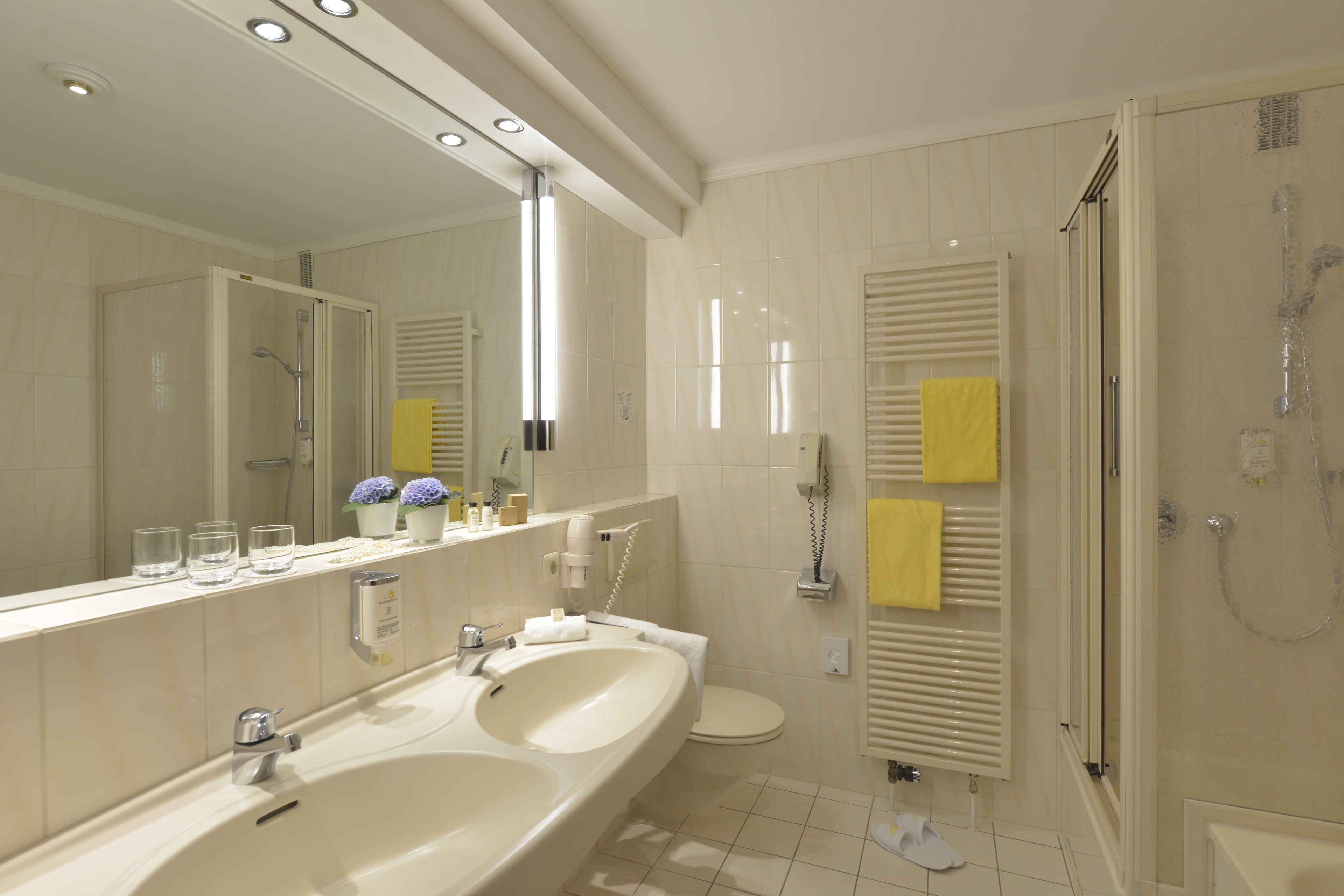 superior double room | bathroom | shower, hair dryer, bathrobes, slippers