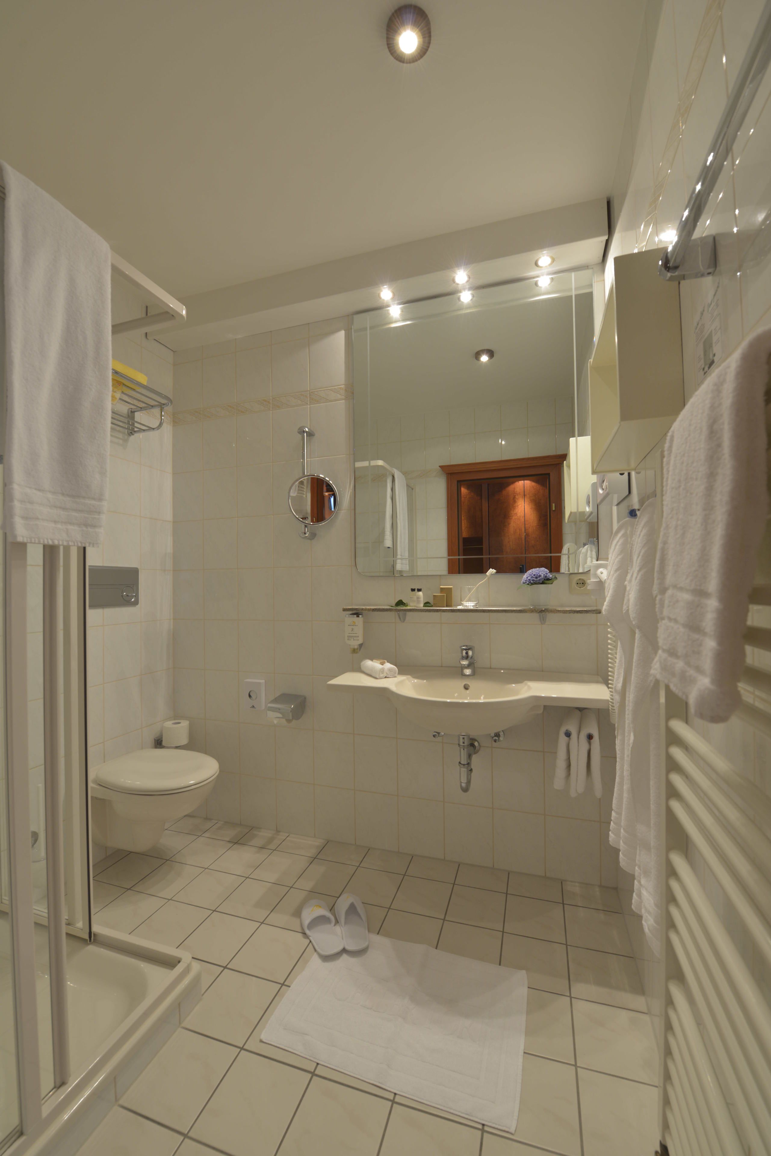 classic single room | bathroom | shower, hair dryer, bathrobes, slippers