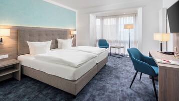 Comfort Double or Twin Room | Down comforters, minibar, in-room safe, individually furnished