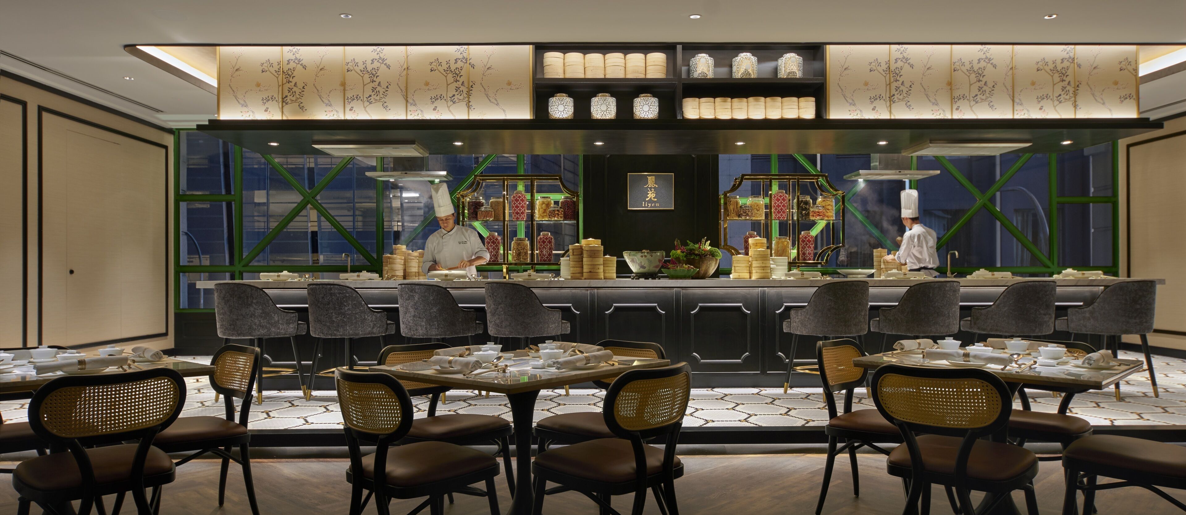 A restaurant with a bar area, multiple tables, and chairs.