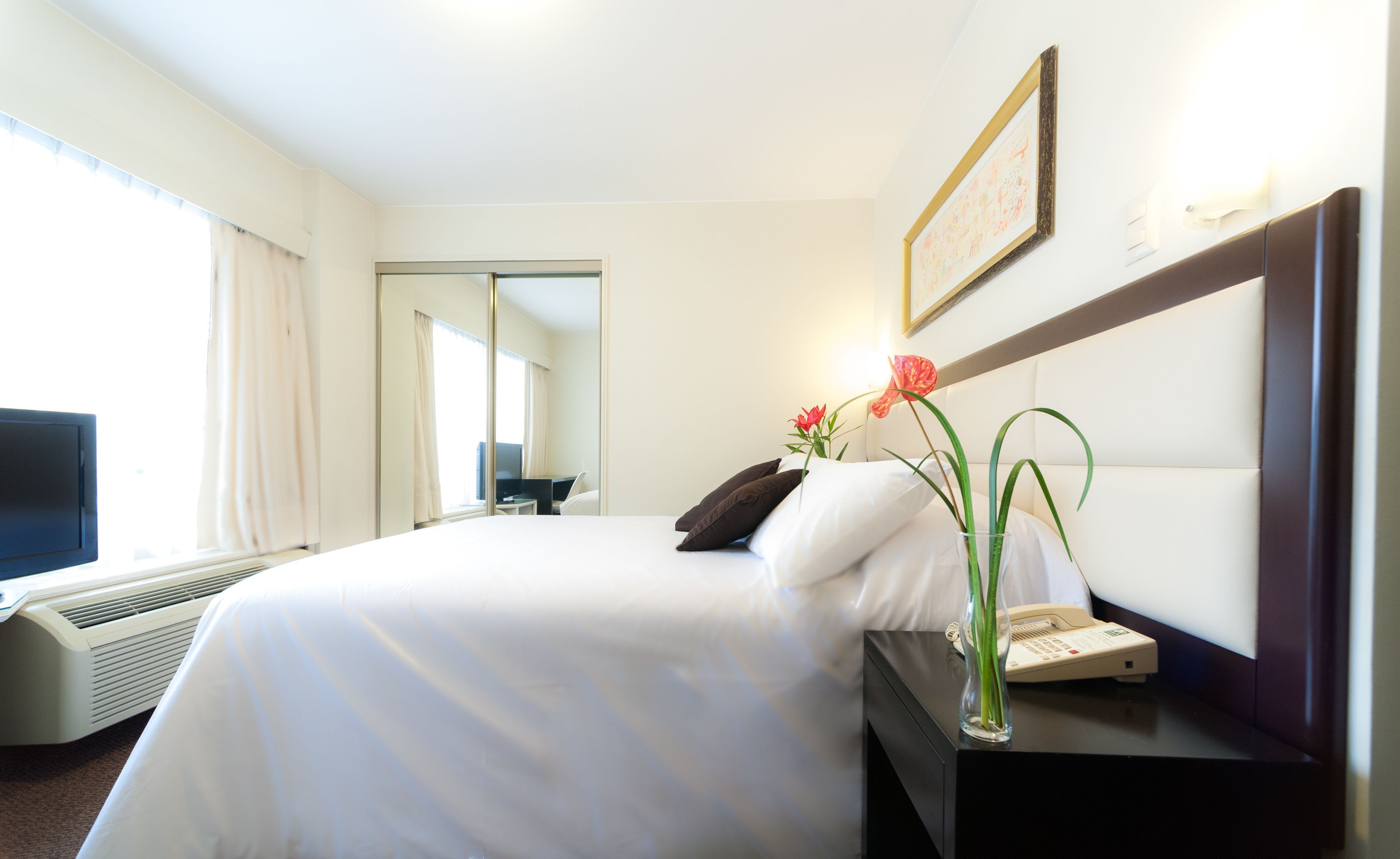 Premium bedding, down comforters, minibar, in-room safe
