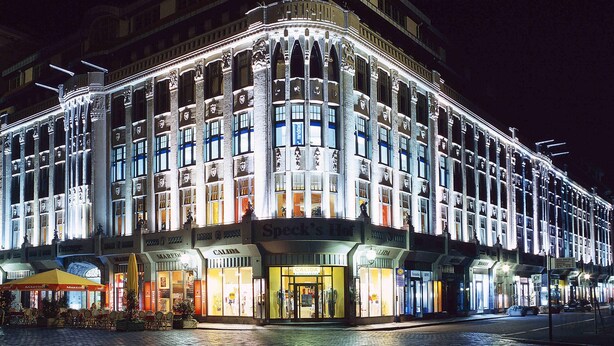 A historic building with multiple stories, large windows, and a prominent corner entrance. - ibis Leipzig Nord Ost (Taucha)