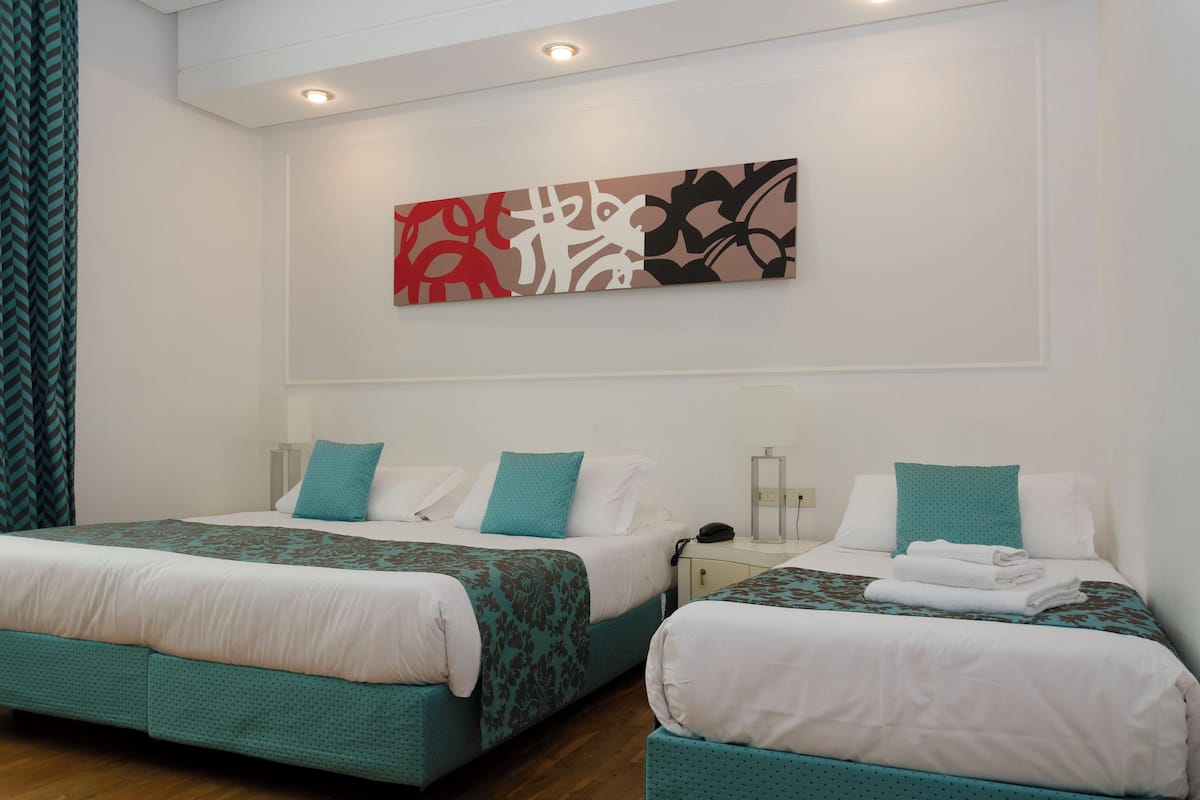 Triple Room | Minibar, in-room safe, desk, soundproofing