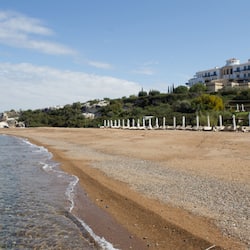 On the beach, sun-loungers, beach umbrellas, beach bar