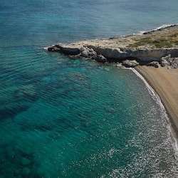 On the beach, sun-loungers, beach umbrellas, beach bar