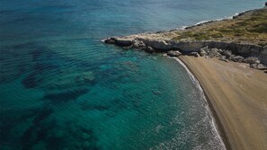 On the beach, sun-loungers, beach umbrellas, beach bar
