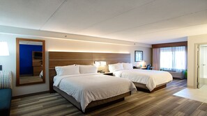 A hotel room with two beds, a large mirror, a desk with a chair, and a window with curtains. - Holiday Inn Express & Suites Tempe by IHG (Tempe)