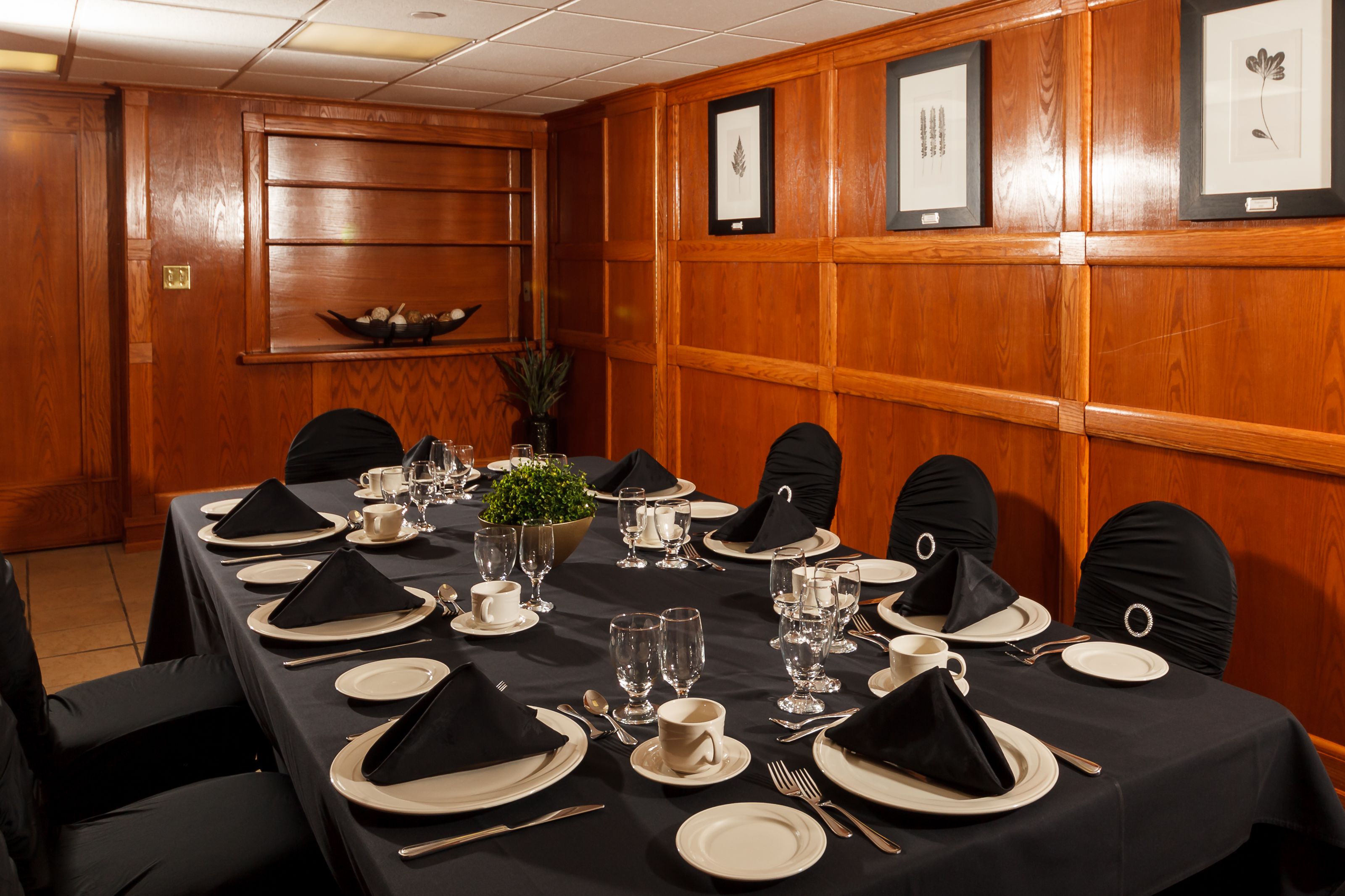 A conference room with a long table set for a meeting.