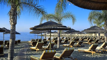 On the beach, free beach cabanas, sun-loungers, beach umbrellas