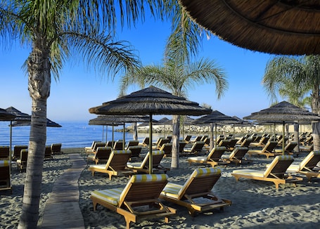 On the beach, free beach cabanas, sun loungers, beach umbrellas. Four Seasons Hotel