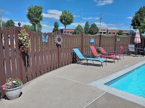 Seasonal outdoor pool, pool umbrellas, pool loungers
