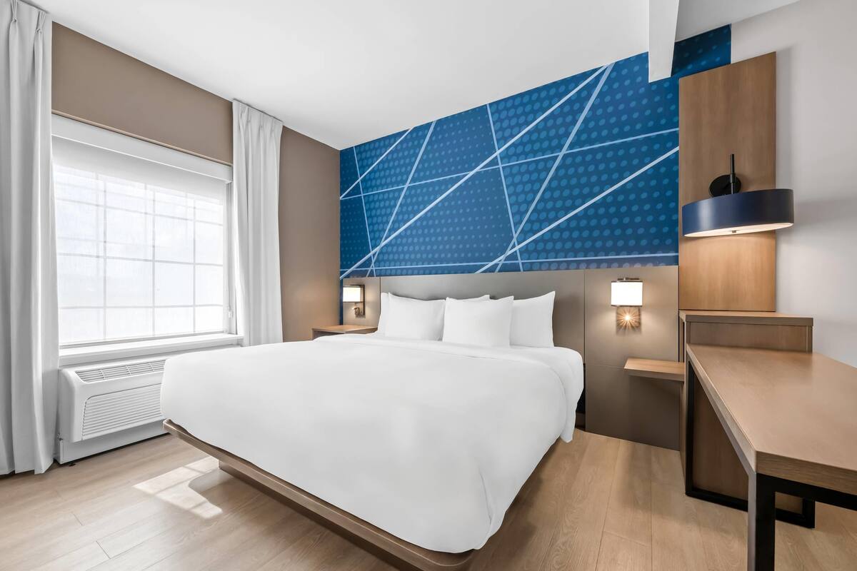 Suite, 1 King Bed with Sofa bed, Non Smoking | In-room safe, desk, laptop workspace, blackout drapes