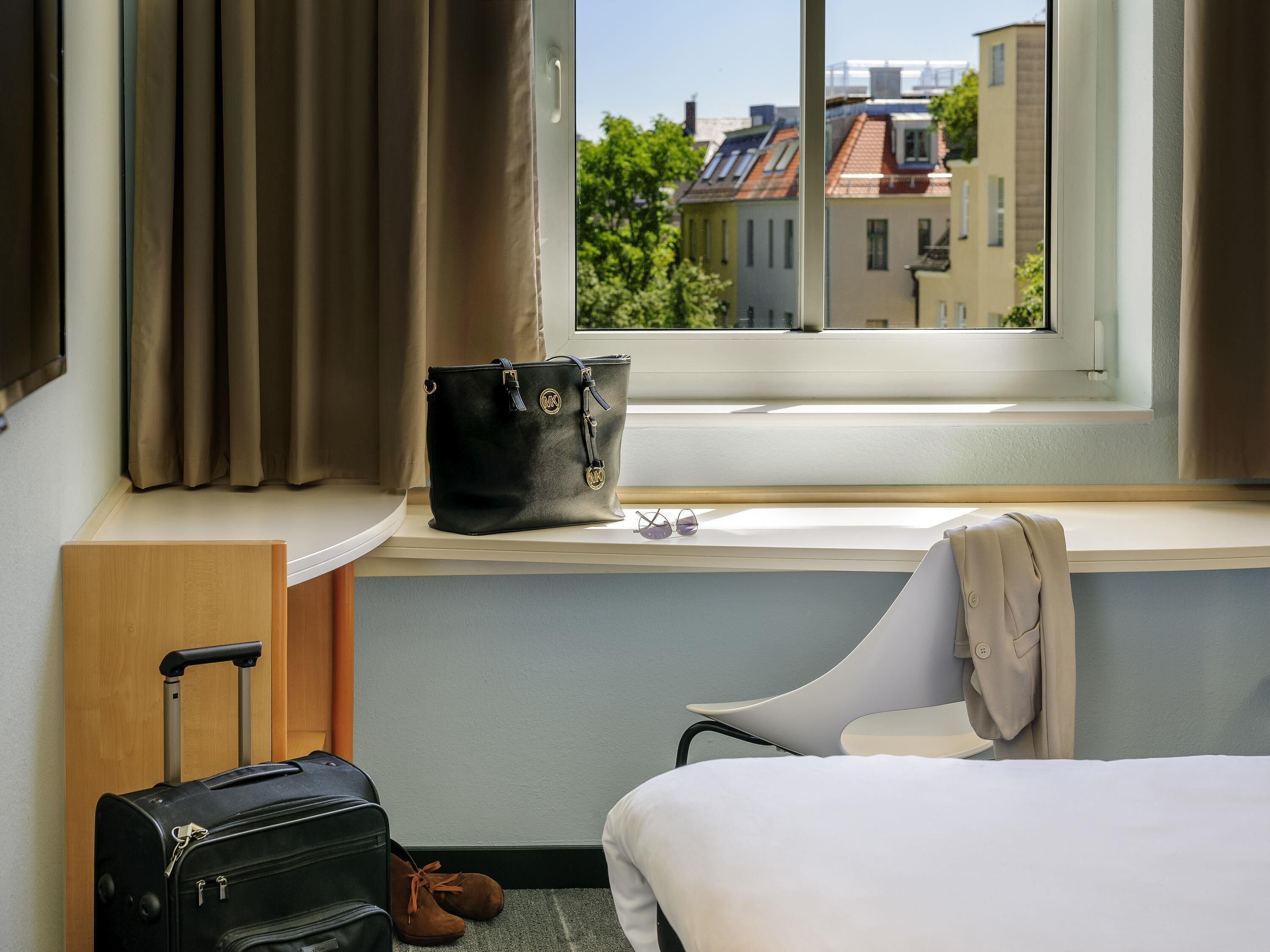 Hypo-allergenic bedding, desk, blackout drapes, soundproofing