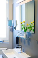 Premium bedding, desk, laptop workspace, blackout curtains