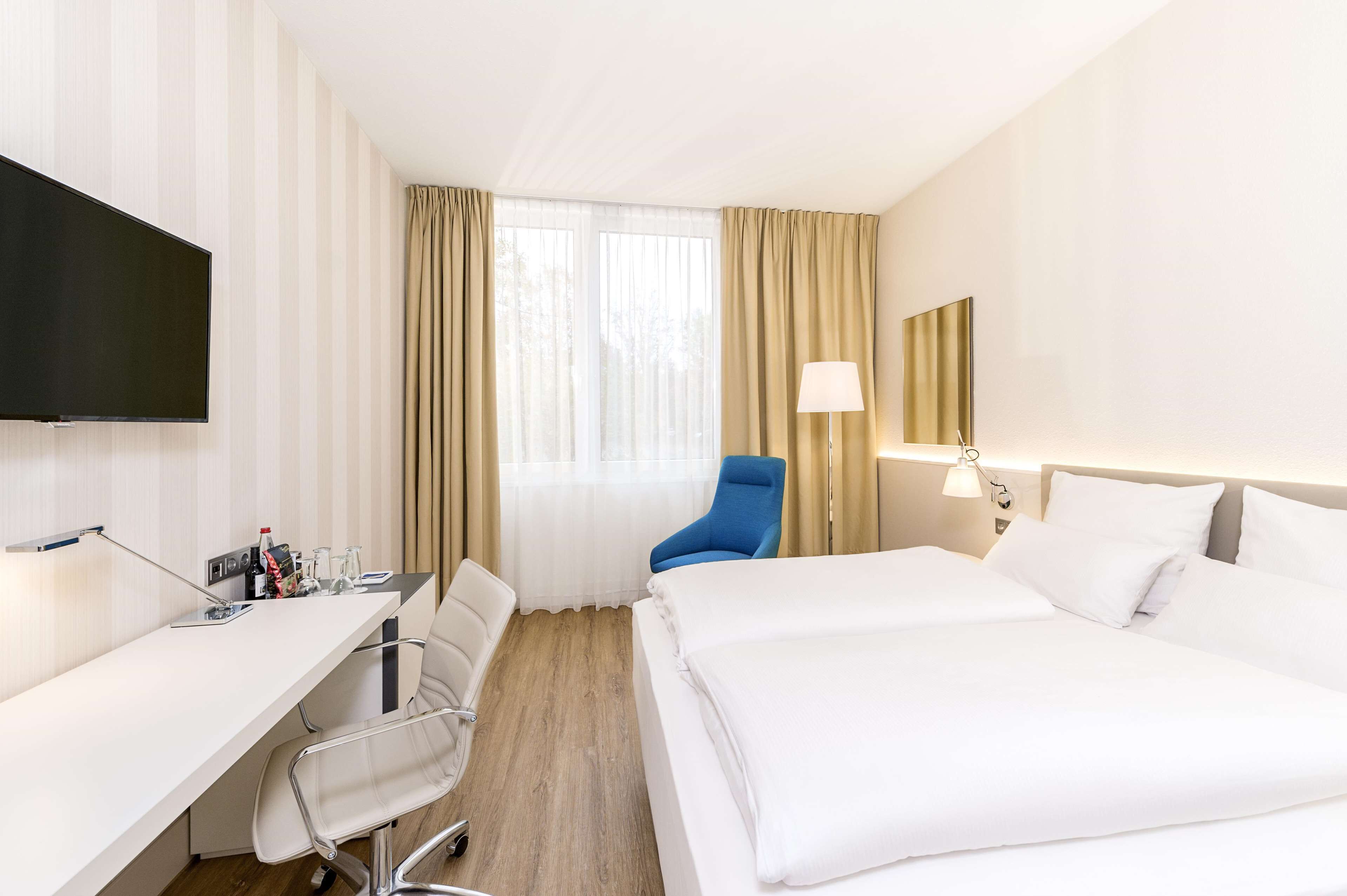 standard double or twin room | pillow-top beds, in-room safe, desk, soundproofing