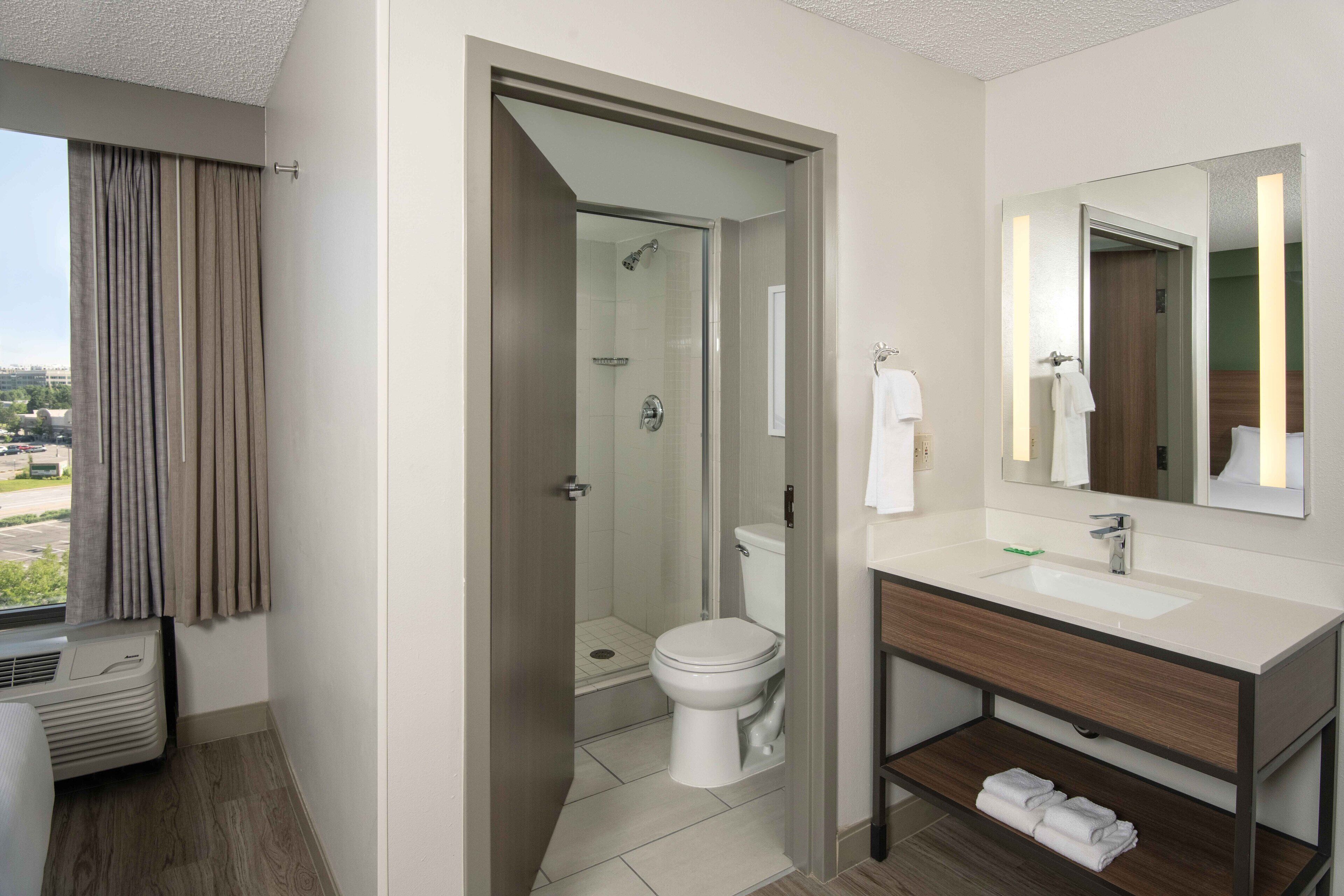 designer toiletries, hair dryer, towels