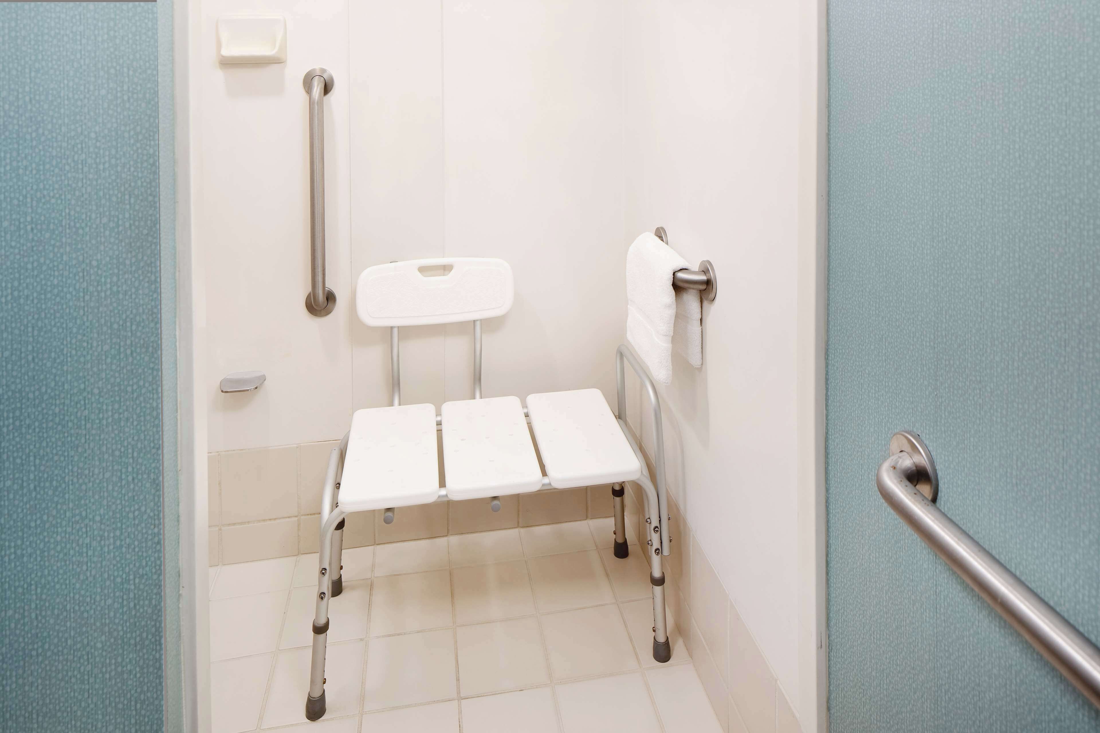 combined shower/bathtub, designer toiletries, hair dryer, towels