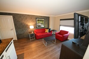 Sunset Bungalow Suite | Living room | 42-inch flat-screen TV with digital channels, TV, pay movies