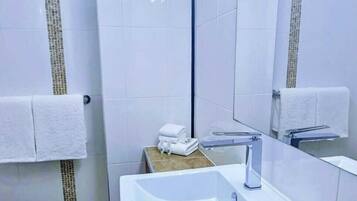 Shower, free toiletries, hair dryer, towels