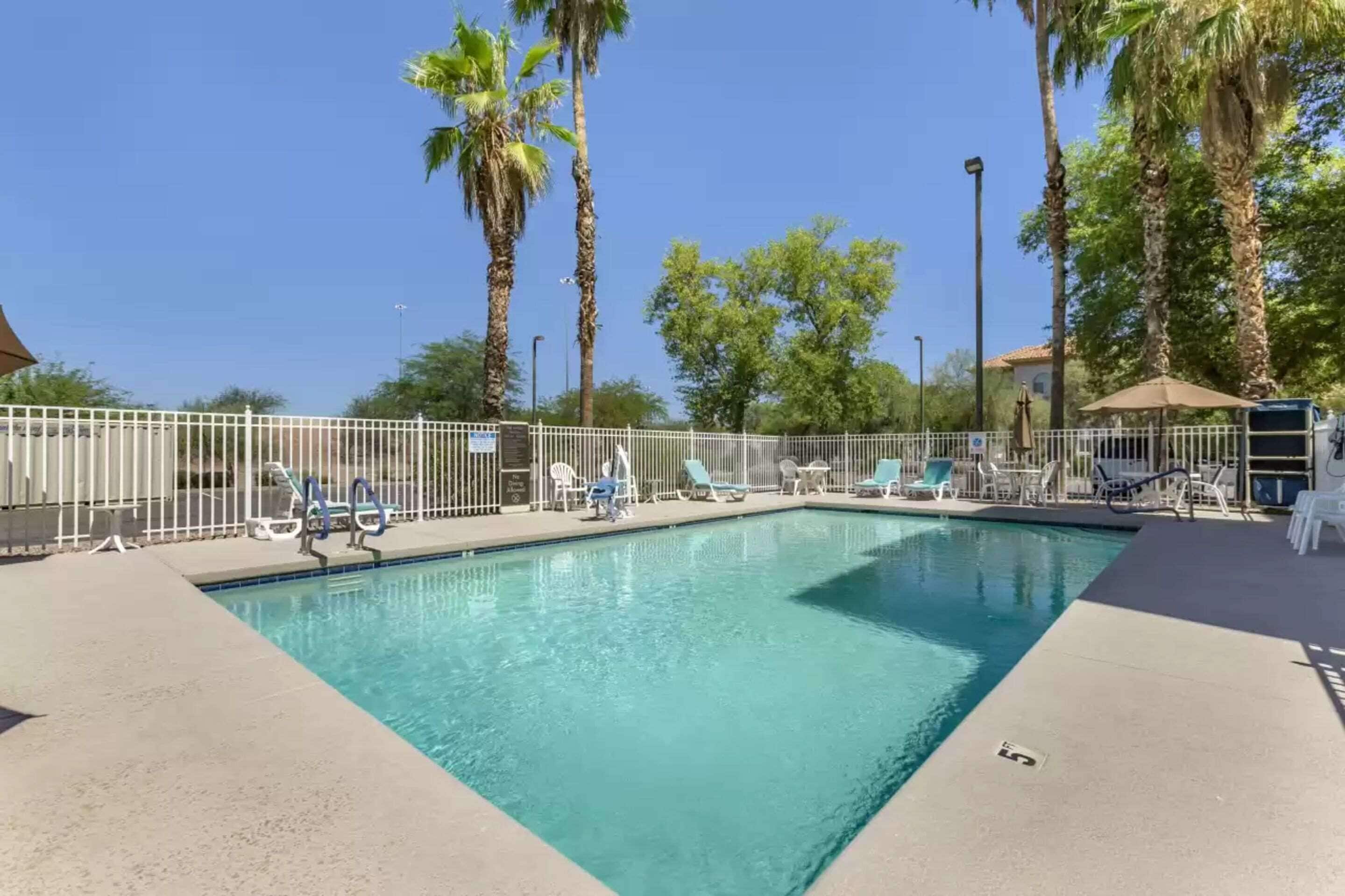 outdoor pool, open 9:00 am to 9:00 pm, pool umbrellas, pool loungers