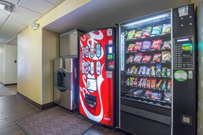 A vending machine and a refrigerator in a hallway. - Red Roof Inn PLUS+ Phoenix West (Phoenix)